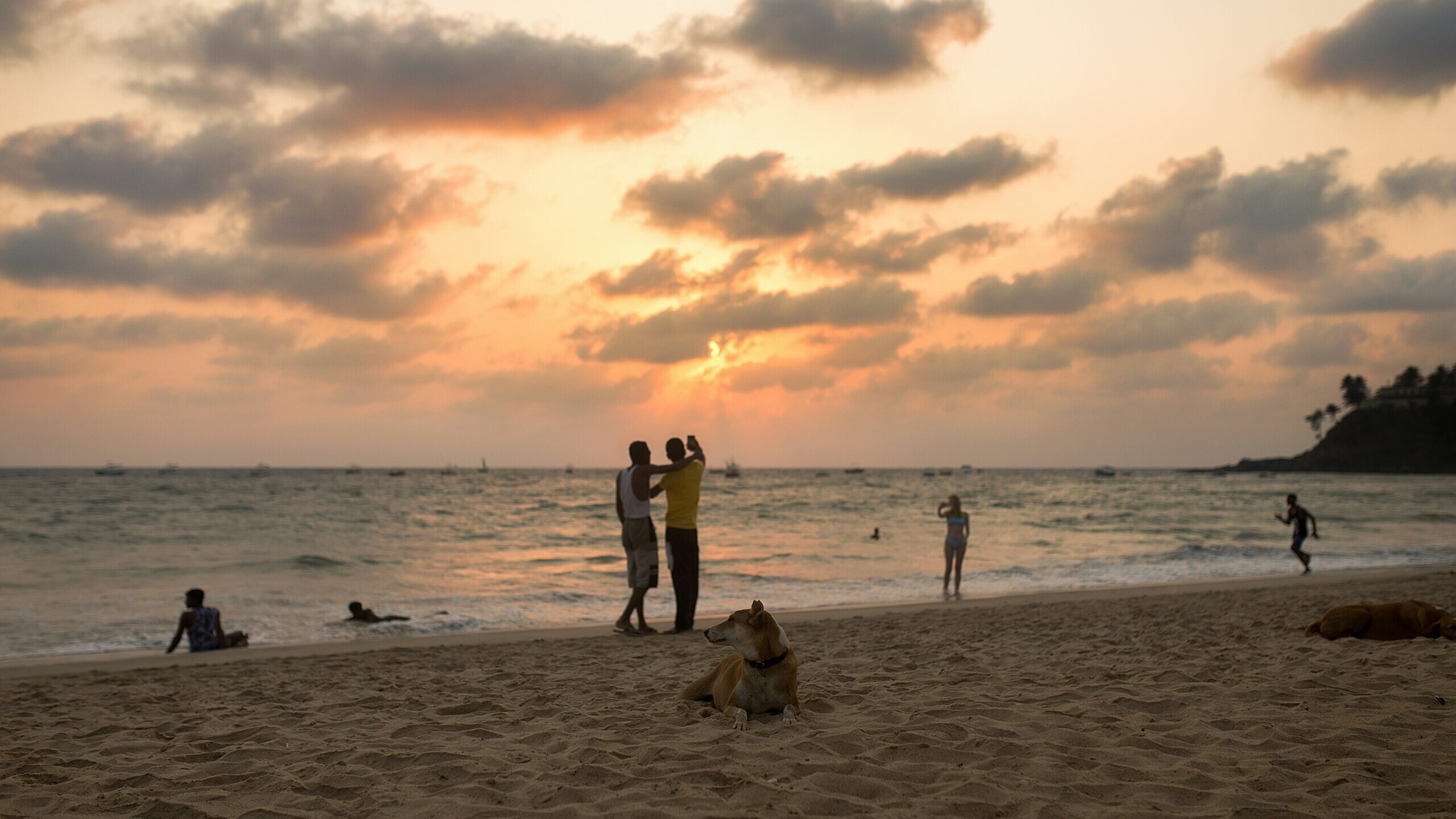 Evening view of Goa Beach with golden sands and a colorful sunset