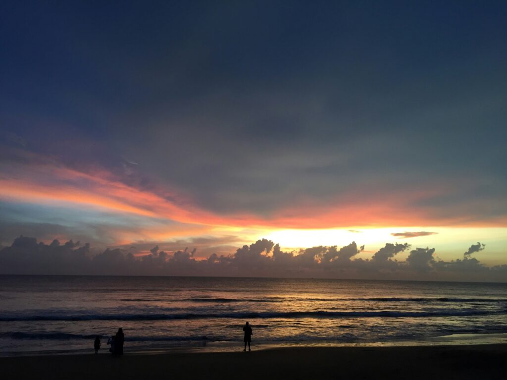 Scenic view of Palolem Beach in Goa with crystal-clear waters at night and vibrant beach shacks