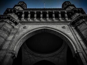 Majestic Gateway to India at sunset with vibrant colors in the sky