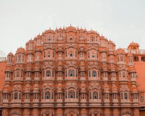 Hawa Mahal, the iconic pink sandstone palace in Jaipur, India, with its intricate lattice windows and stunning Rajput architecture